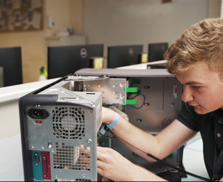 Sixth Form student working on computer hardware